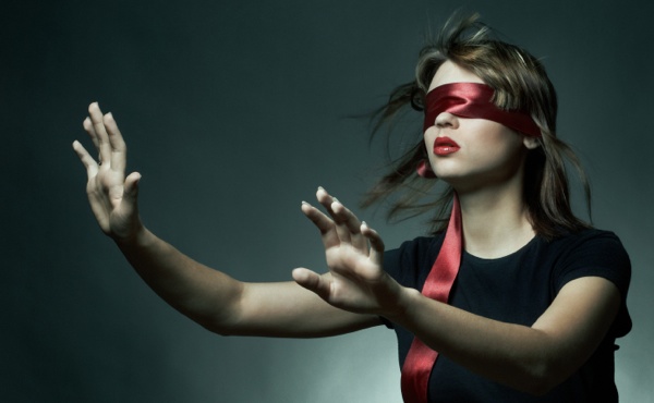 Portrait of the young woman blindfold